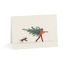 Eco-friendly Christmas greeting card with a man carrying a tree and a dog in the snow