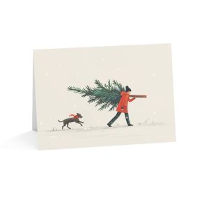 Eco-friendly Christmas greeting card with a man carrying a tree and a dog in the snow
