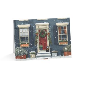 Eco-friendly Christmas greeting card featuring a cozy townhouse with festive decor and snowfall